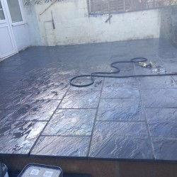 Customer had old slippery decking. We demolished it and built retaining wall and laid new patio slabs.