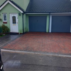 Finished block paving job complete with drainage.